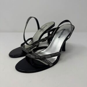Bebe Y2K Logo Monogram‎ Strappy Sandals Womens 6M Black Silver Stiletto Heel